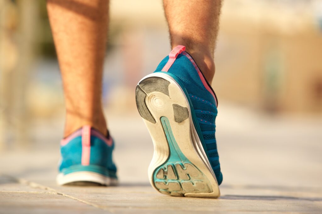 sport shoes of young man walking